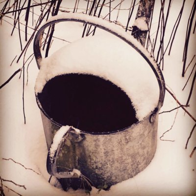 Watering can in the snow