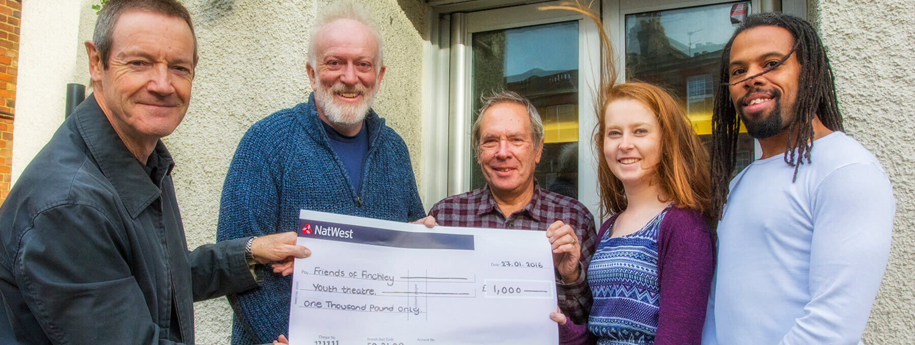 Peter Hale (left) handing over the EFOA donation to the East Finchley Youth Theatre